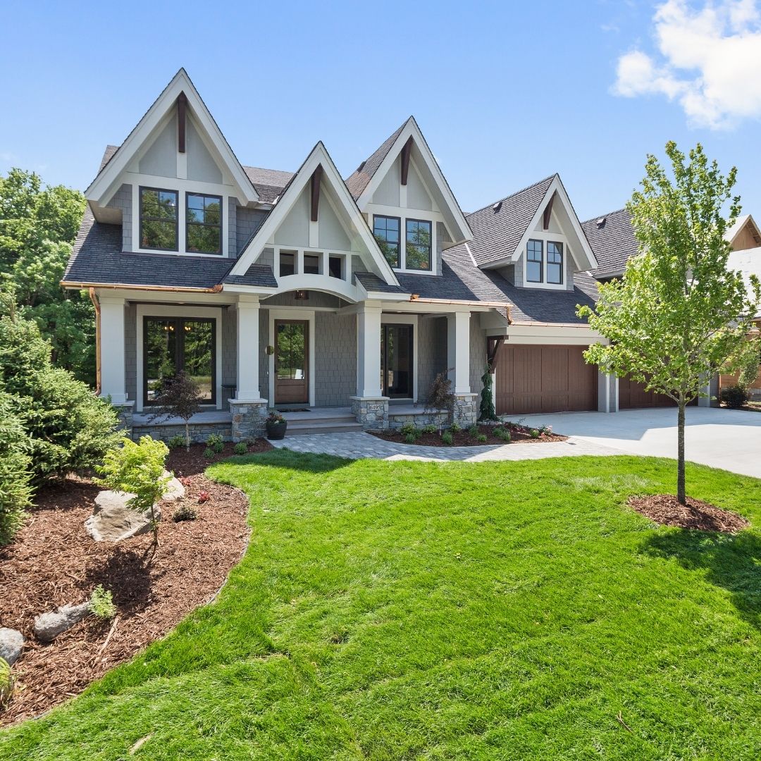 fancy home with well-kept yard