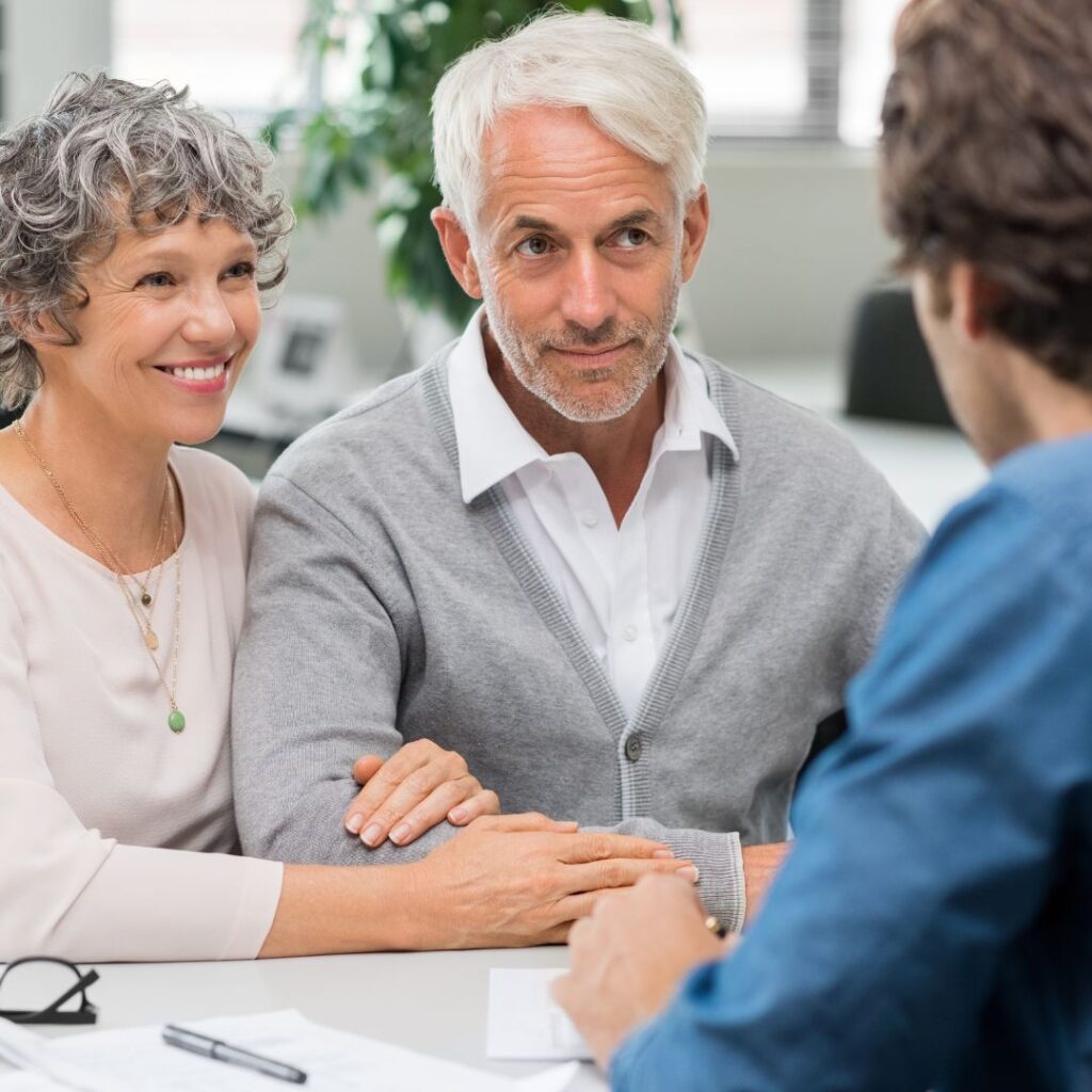 retired couple working with banker