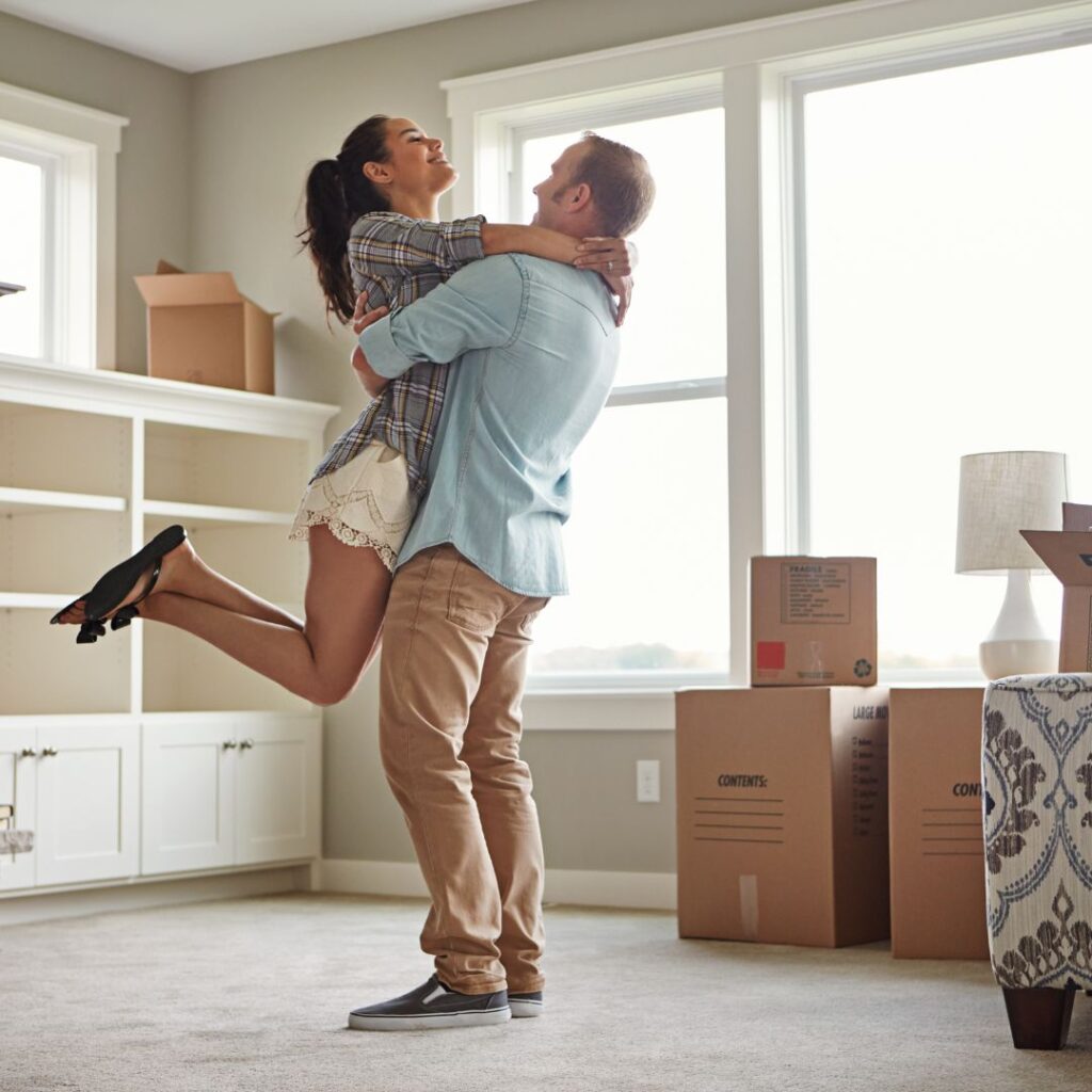 happy couple in new home