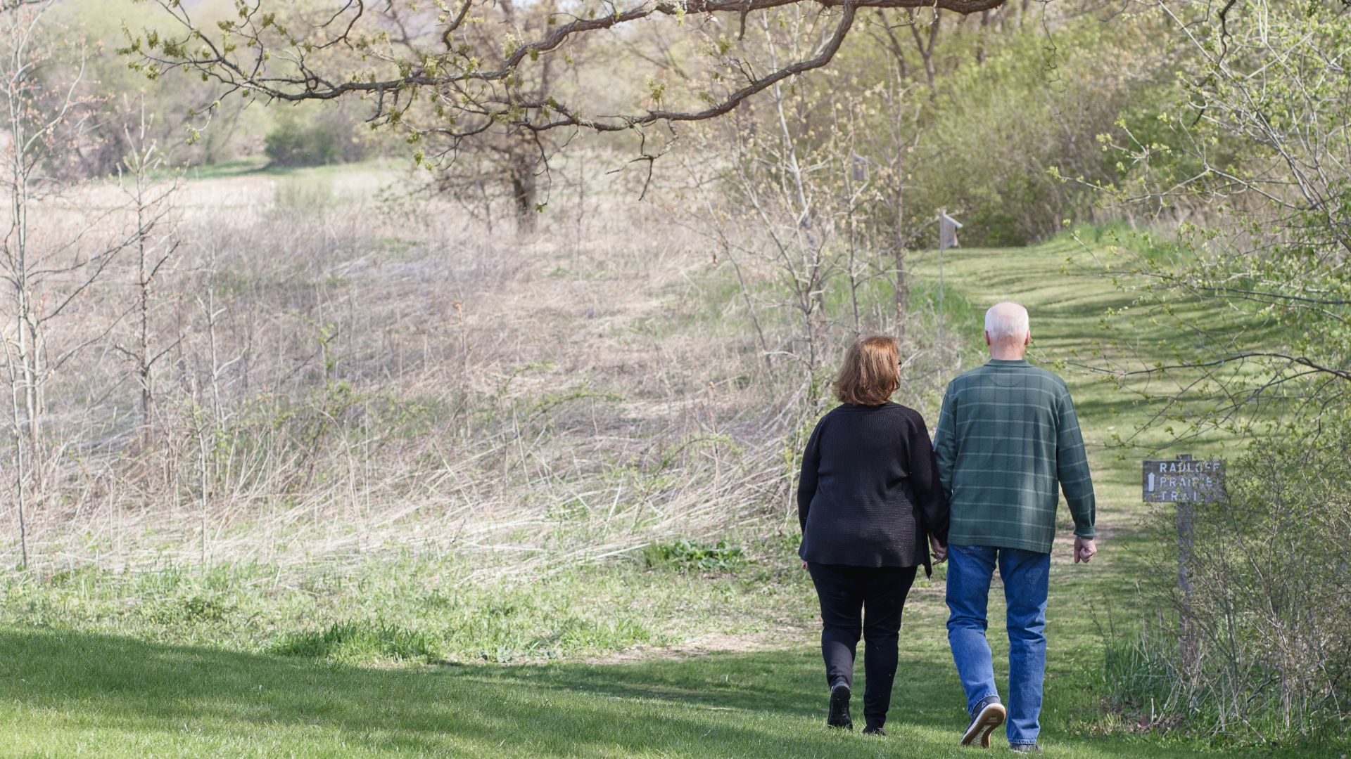 couple walking on big property