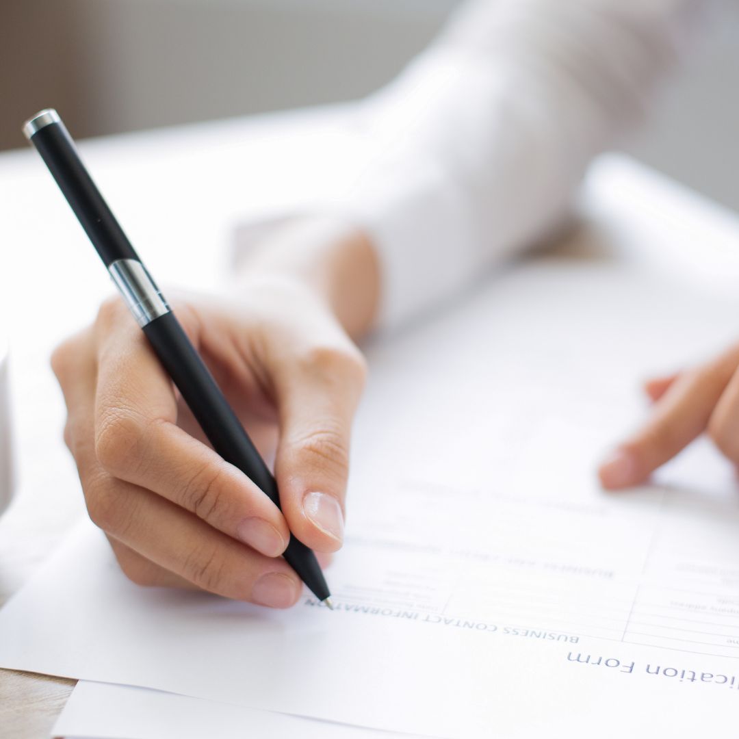Person writing on paper