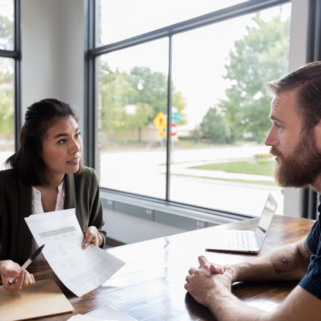 people looking at paperwork together