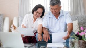 Senior couple reviewing finances happily