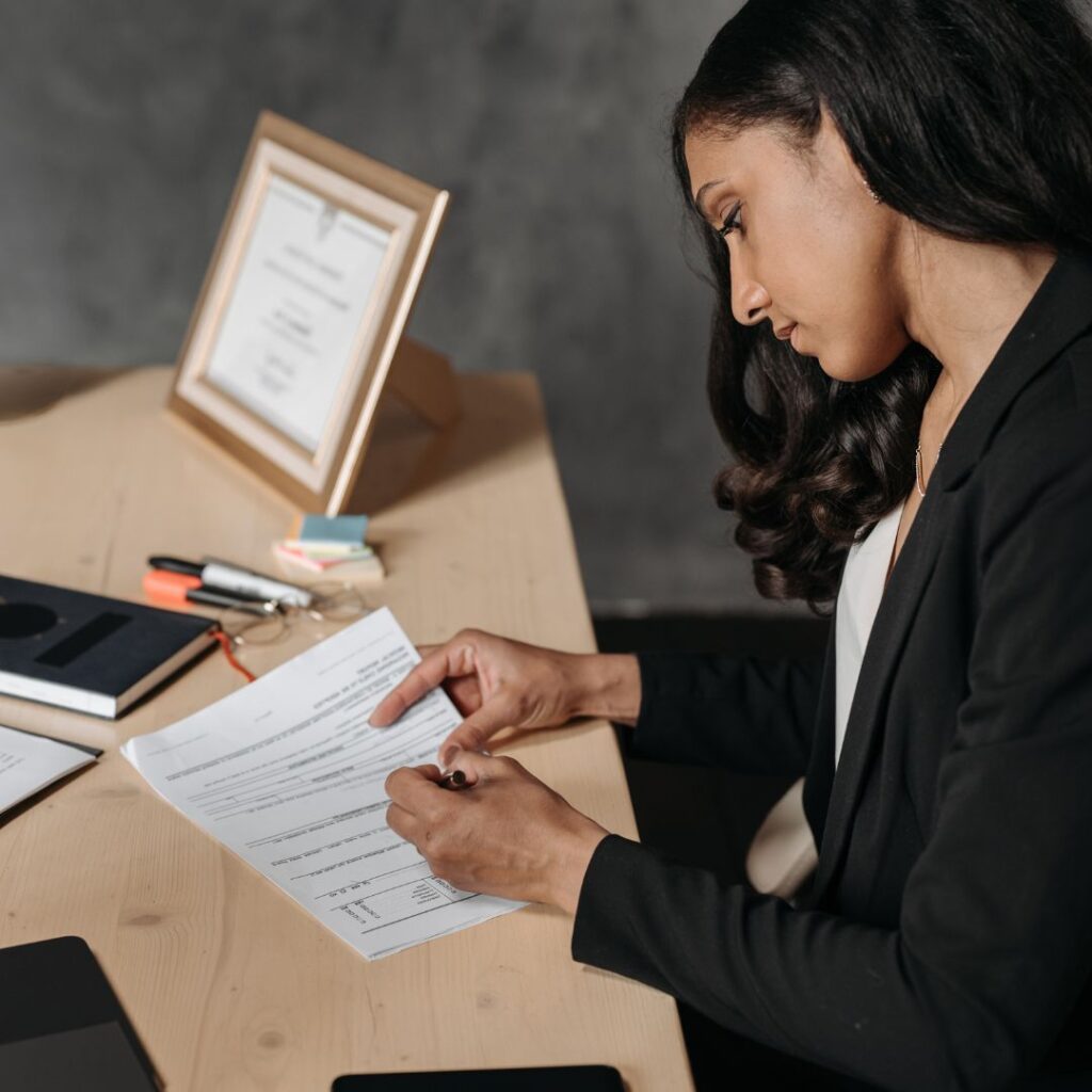 A woman reviewing paperwork