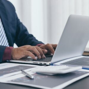 Typing on a laptop
