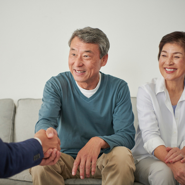 retired couple talking with a non-recourse loan lender