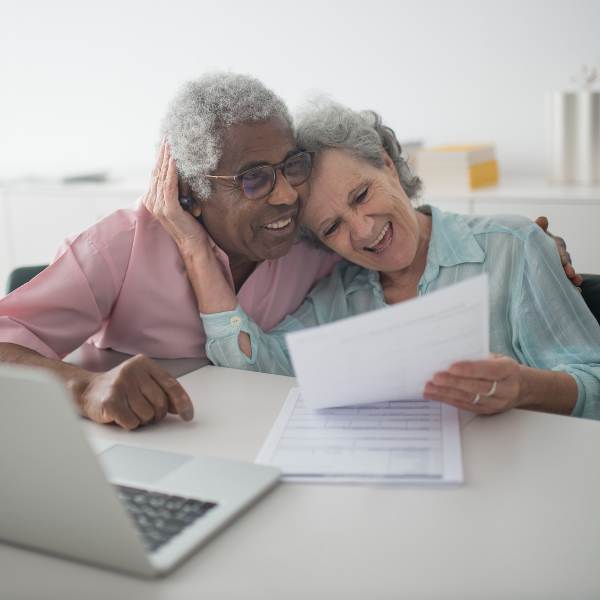 retired couple looking at their investment portfolio